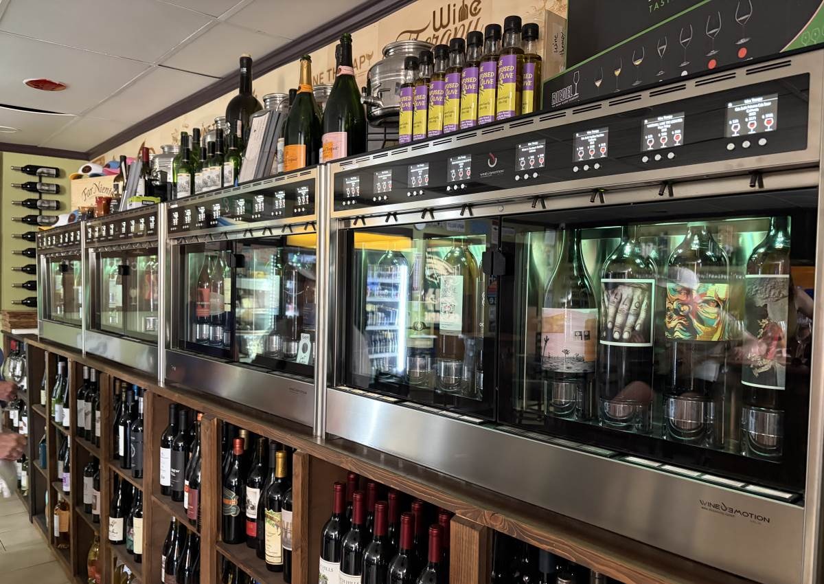 Browsing the rotating wine selection at Wine Therapy